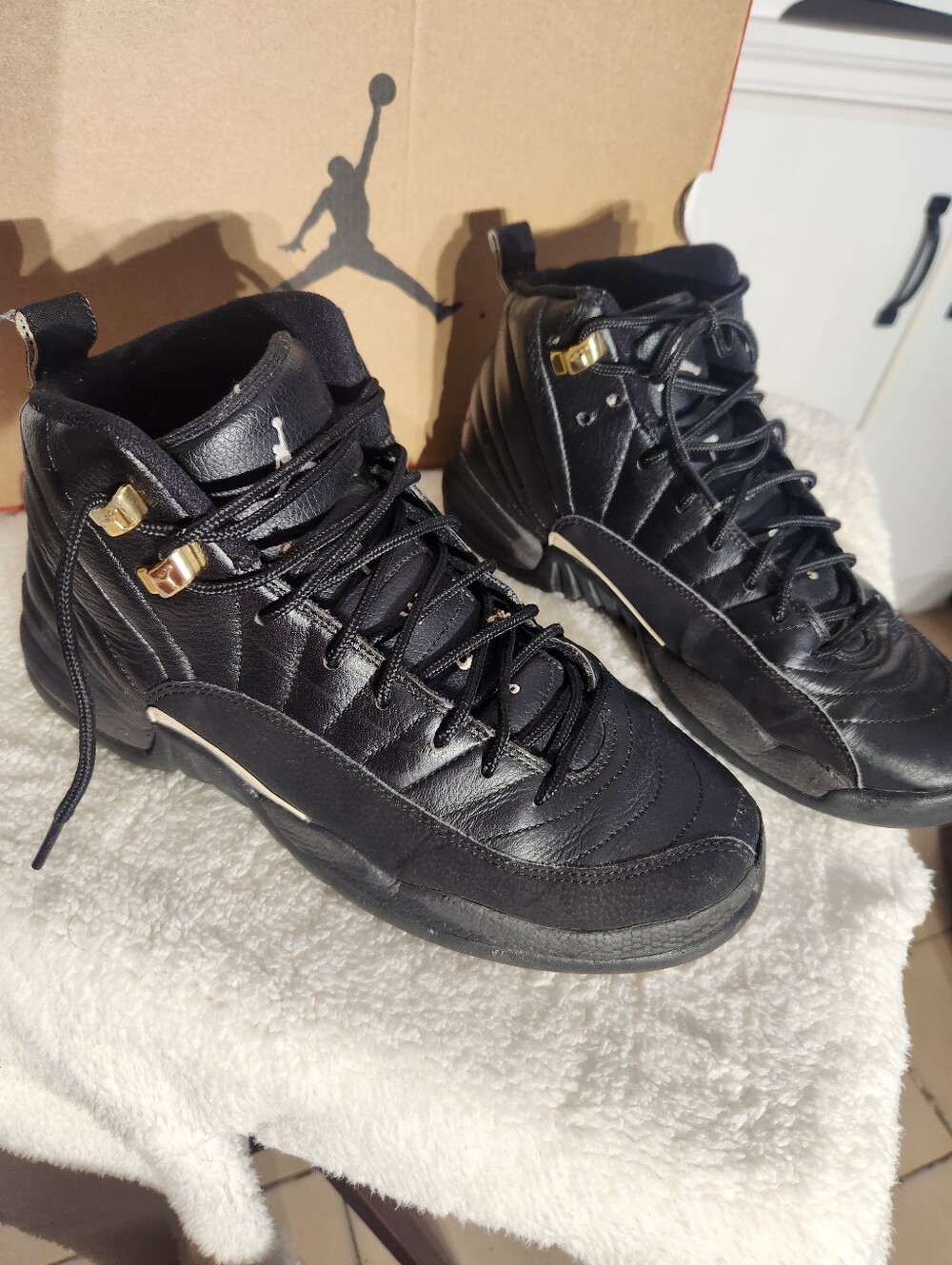 Nike Black Air Jordans 12 Sneakers with Gold Accents